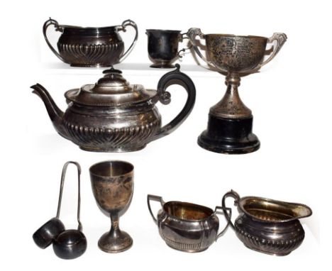 A tray of silver items including a George V three part tea service by Harrison Brothers &amp; Howson, assayed Sheffield 1924,