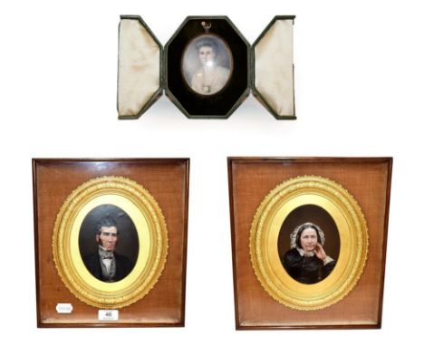 An oval portrait miniature of a lady in fitted leather easel case circa 1920, together with a pair of Victorian oval portrait