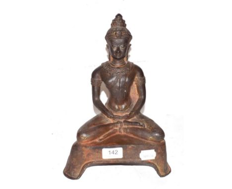 A 19th century cast metal statue of a seated Buddha, possibly Thai, 31cm