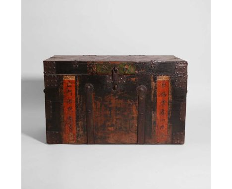 A painted elm and iron-bound trunk, 19th century, Chinese or Korean , with a pair of wrought-iron handles, the front painted 