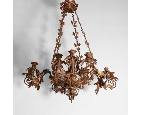 A gilt-metal twelve-light chandelier, 19th century, French, with four scrolled three-branch arms and a central column,74cm di