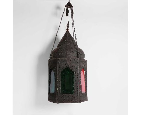A pierced-brass hexagonal ceiling lantern, late 19th to early 20th century, Moroccan, with coloured glass panels,22cm wide62c
