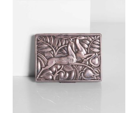 An Art Deco silver compact, c.1920, American, depicting two leaping gazelles amongst foliage, with a mirrored lid, marked 'St
