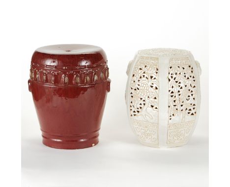 Group of two ceramic garden stools or garden barrels. One with white glaze, in hexagonal form with pierced and incised decora