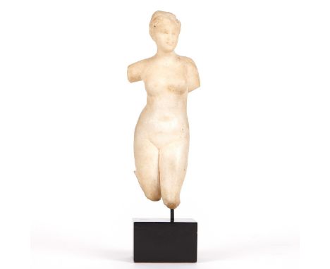 Small classical marble figure of a woman, likely the goddess Venus. She is depicted nude, her left leg placed slightly forwar