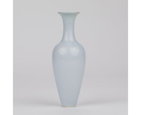 Chinese porcelain claire-de-lune vase. Delicately potted, of baluster form with a flaring lip. Marked along the underside wit