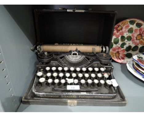 A vintage Underwood portable typewriter with case