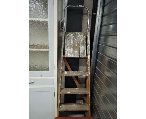 A set of vintage wooden stepladders