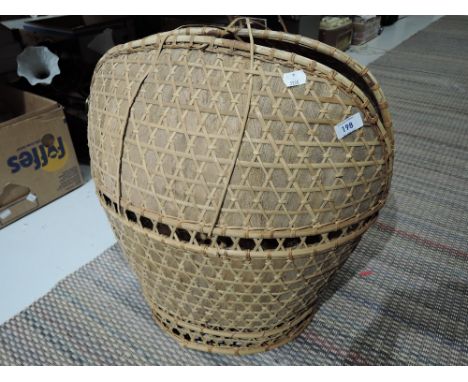 A vintage style woven laundry or other basket