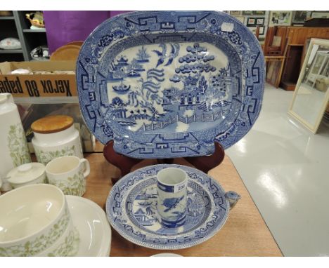 A selection of vintage blue and white transfer printed ceramics including willow ware charger
