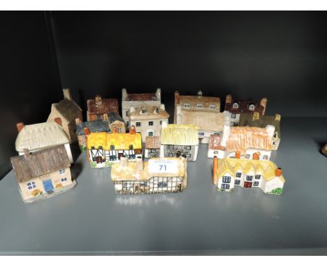 A selection of decorative ceramic houses similar to Lilliput lane