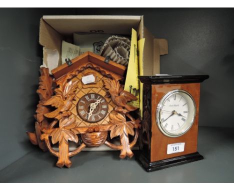 A vintage wooden bodied Cuckoo clock by Schneider etcLooks like all parts of the clock are present, modern with no wood worm.