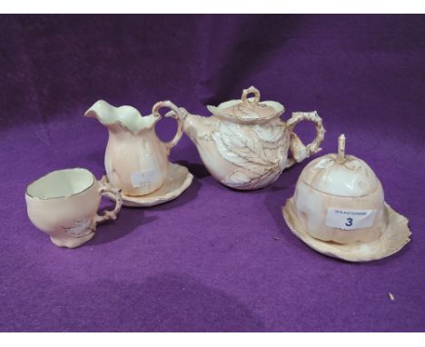 A vintage tea set for one in a fruit and leaf style design