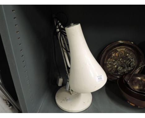 A vintage angle poise lamp in cream