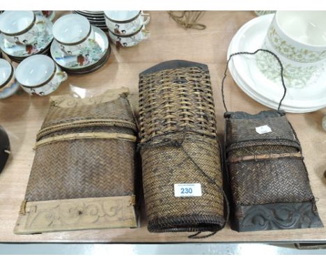 A selection of vintage ethnic style woven baskets and carry bags
