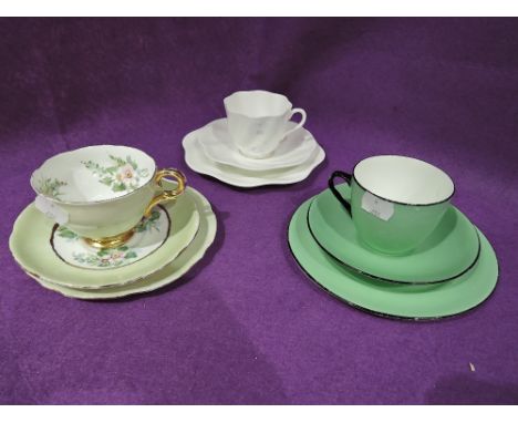 A selection of vintage tea cups and saucers including hand decorated set by E. Lowcock