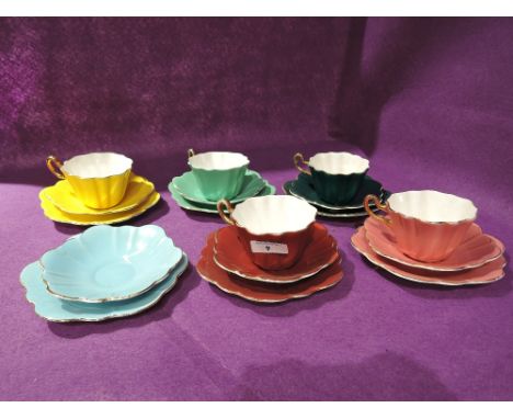 A selection of vintage tea cups and saucers in a harlequin design by Royal Stuart Spencer Stevenson