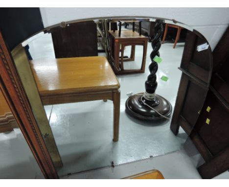 A vintage frameless mirror