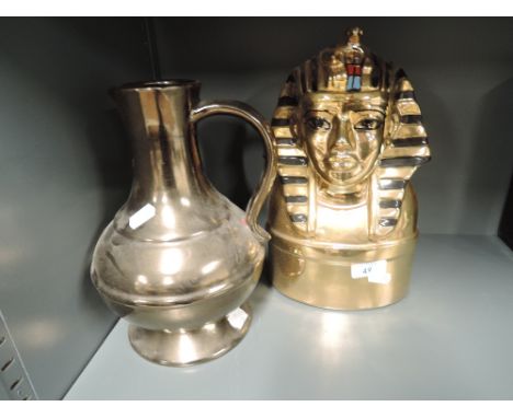 A vintage ceramic decanter in the form of an Egyptian sarcophagus etc