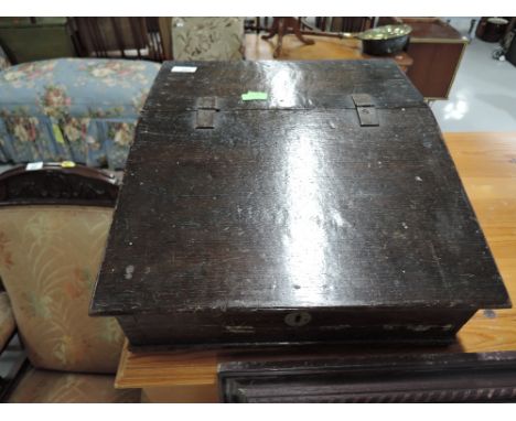 A vintage rustic oak writing slope