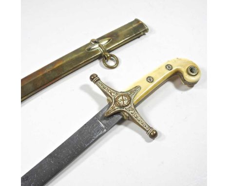 A Victorian general officer's mameluke sword, having a curved ivory handle and brass cross hilt and etched curved steel blade