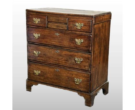An oak 18th century Norfolk chest, containing an arrangement of four short drawers, over three long drawers, on bracket feet,