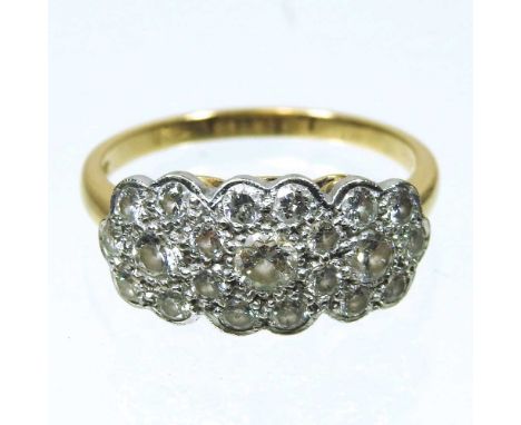 An 18 carat gold and diamond triple cluster ring, set with three central diamonds, within a diamond surround, approximately o