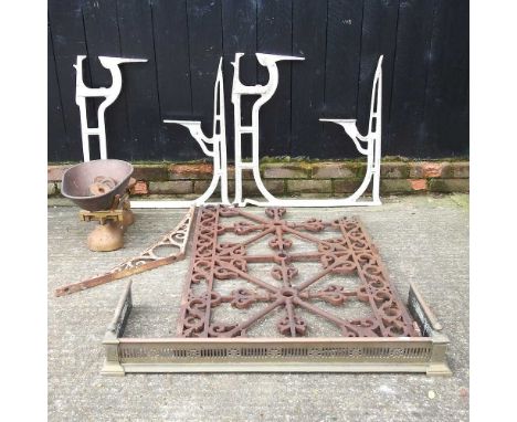 A cast iron gate panel, 72 x 105cm, together with a pair of white painted bench ends, brackets, scales and a fender (6)