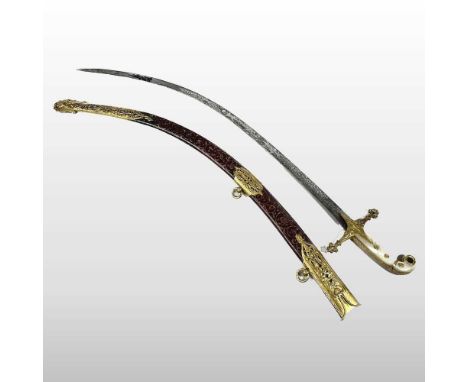 An early 20th century Indo-Persian/Ottoman shamshir dress sword, having a curved mother of pearl handle, with a gilt cross hi