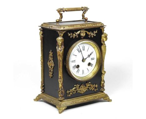 A 19th century continental ebonised mantel clock, with gilt metal mounts, having a white enamel dial with Roman hours, the ei