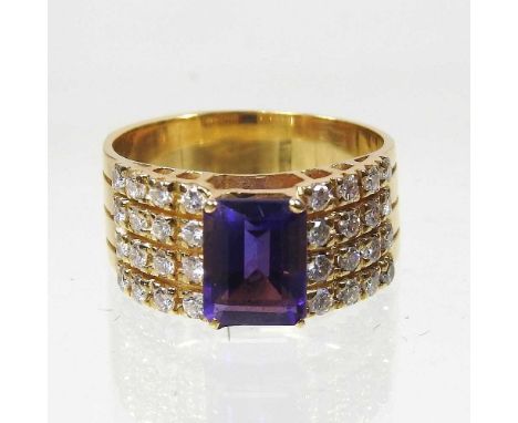 An unmarked amethyst and diamond ring, set with a single amethyst, flanked by thirty-two diamonds, approximatley one carat gr