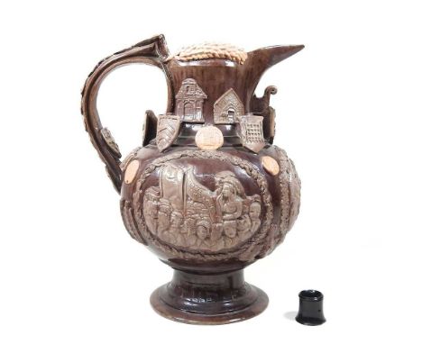 A Castle Hedingham pottery 'The Essex Jug', dated 1891, decorated in relief with roundels depicting Grecian scenes and applie