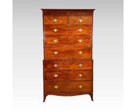 A Regency mahogany chest on chest, with a moulded cornice, the upper section containing two short over three long drawers, wi