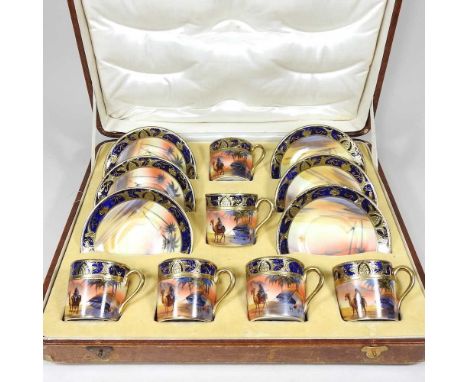 An early 20th century Noritake coffee set, with six settings, in a fitted case, 38cm wideOne cup has a hairline crack down th