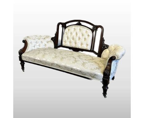 A Victorian cream silk upholstered show frame sofa, with a button back, on turned legs and castors174w x 76d x 94h cm