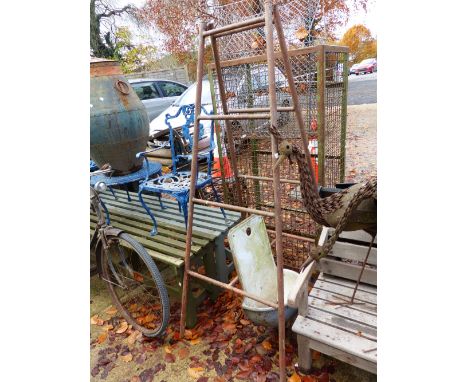 A FOLDING METAL TRESTLE STAND AND A FRENCH ENAMEL WALL BASIN. 