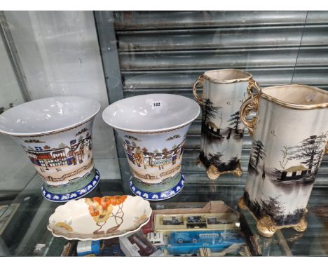 A CLARICE CLIFF DISH TOGETHER WITH TWO PAIRS OF VASES