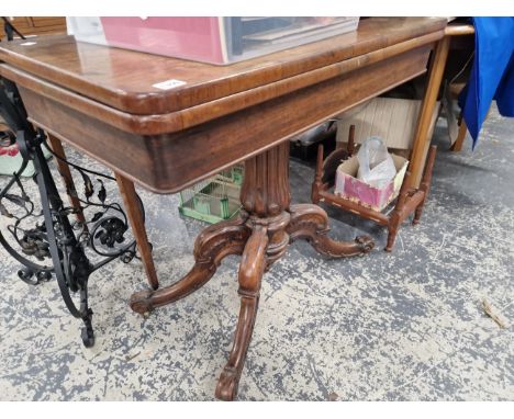 A VICTORIAN FOLD OVER CARD TABLE. 