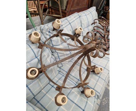 A WROUGHT IRON CHANDELIER. 