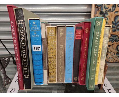 TWELVE FOLIO SOCIETY VOLUMES IN A WOODEN BOOK TROUGH