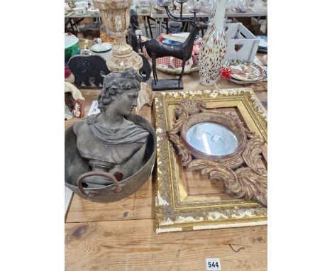 A CARVED FRAMED MIRROR, A BRASS COOK PAN, SPELTER BUST, A CANDLESTICK ETC. 