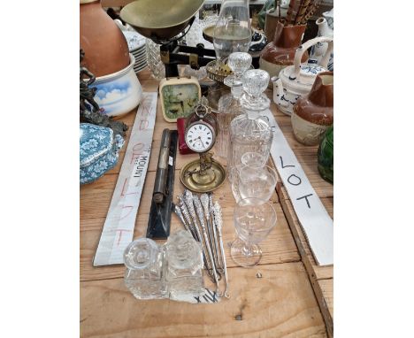 A SILVER CASED POCKET WATCH ON A BRASS STAND. BUTTON HOOKS, AN OIL LAMP, KITCHEN SCALES AND GLASS WARE