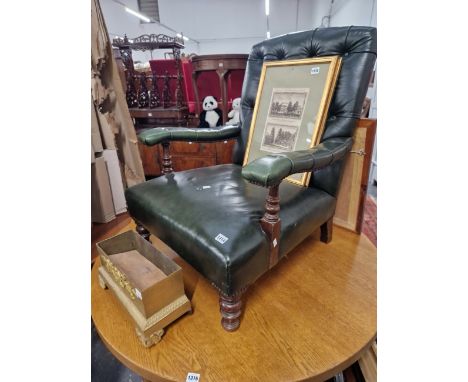 A VICTORIAN BUTTON UPHOLSTERED ARM CHAIR. 