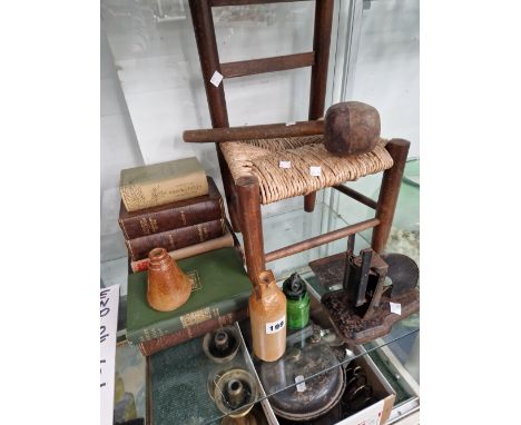 A CHILDS RUSH SEATED CHAIR, BOOKS, LETTER SCALES, TWO SALT GLAZE FLASKS AND A GREEN PHARMACY BOTTLE