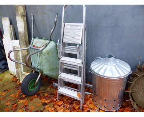 A FOLDING ALUMINIUM LADDER, A STEP LADDER, AN INCINERATOR, A WHEEL BARROW AND A SPIRIT LEVEL.