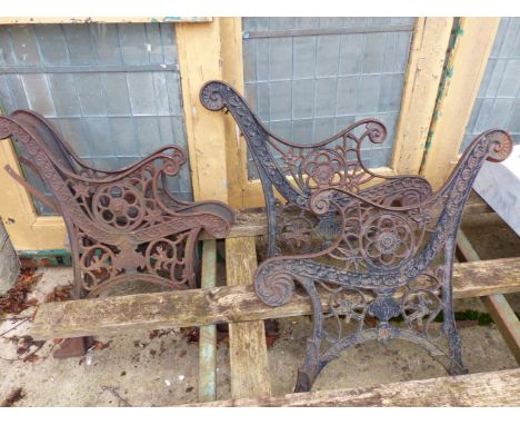 TWO PAIRS OF CAST IRON BENCH ENDS.