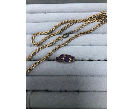 A 9ct HALLMAKED GOLD AND AMETHYST DRESS RING AND A 9ct GOLD ROPE CHAIN FITTED WITH A PLATED LOBSTER CLASP. GROSS WEIGHT 7.34g