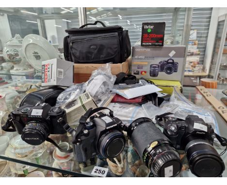 A PENTAX P30, AN OLYMPUS E450 AND A FUJIFILM S 5000 CAMERA WITH CASES, LENSES AND ACCESSORIES