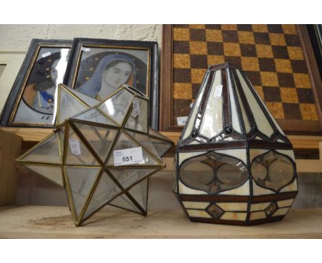 A glass star shaped pendant lamp together with a cream and amber coloured glass ceiling shade