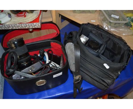 Minolta XG2 camera together with a quantity of assorted lenses and accessories